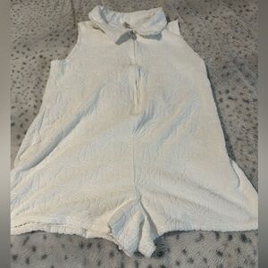 White Sleeveless Textured Romper with Shell Motif